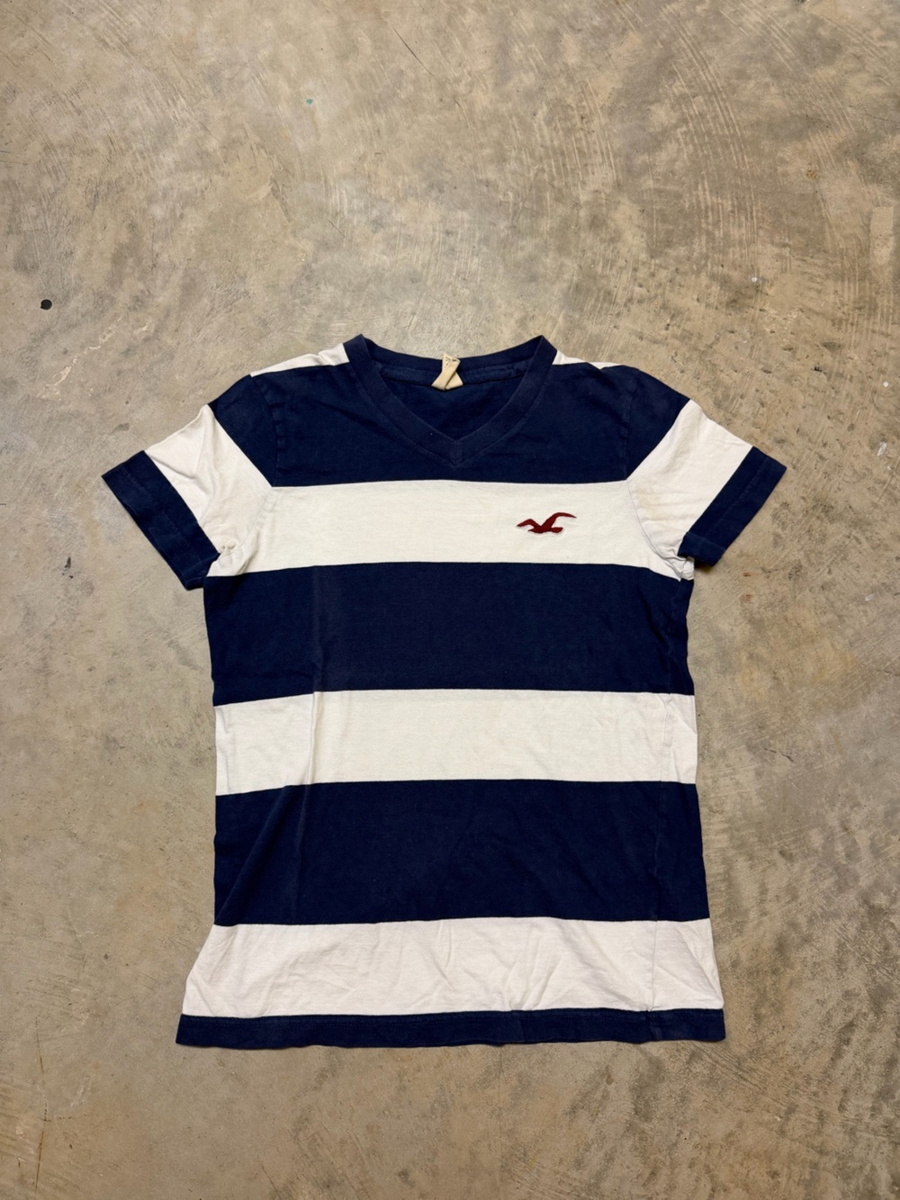 Hollister Navy & White Striped V‑Neck Tee with Red Logo
